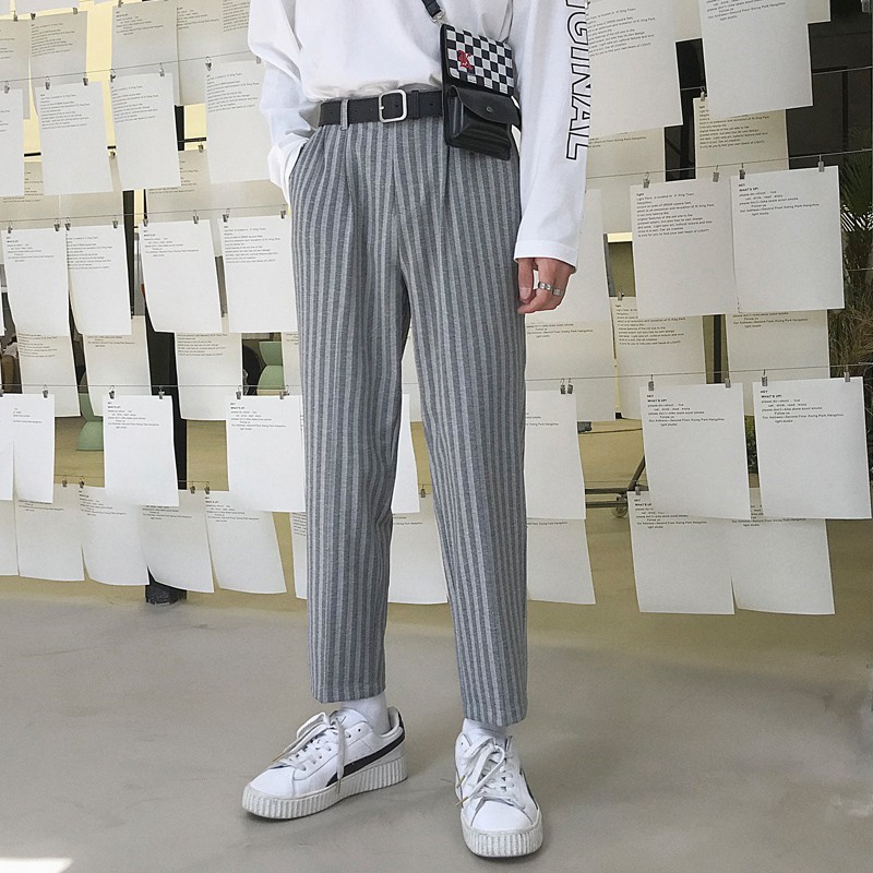 Quần tây họa tiết sọc dọc là chân ái với những bạn chân to