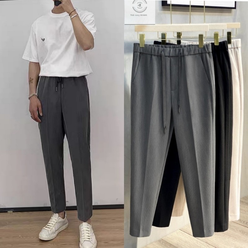 Quần tây màu sẫm làm bằng vải suông sẽ giúp các chàng trai chân to trở nên thon gọn